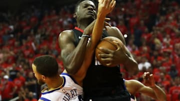 HOUSTON, TX - MAY 28: Clint Capela #15 of the Houston Rockets goes up against Stephen Curry #30 of the Golden State Warriors in the second quarter of Game Seven of the Western Conference Finals of the 2018 NBA Playoffs at Toyota Center on May 28, 2018 in Houston, Texas. NOTE TO USER: User expressly acknowledges and agrees that, by downloading and or using this photograph, User is consenting to the terms and conditions of the Getty Images License Agreement. (Photo by Ronald Martinez/Getty Images)