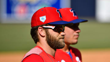 TAMPA, FL - MARCH 13: Bryce Harper #3 and J.T. Realmuto #10 of the Philadelphia Phillies get ready to warm up before the spring training game against the New York Yankees at Steinbrenner Field on March 13, 2019 in Tampa, Florida. (Photo by Mark Brown/Getty Images)