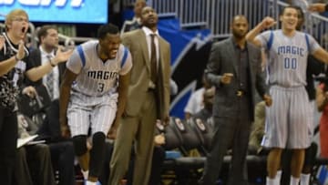 Mar 8, 2015; Orlando, FL, USA; Orlando Magic center Dewayne Dedmon (3) reacts after forward Maurice Harkless (21) (not pictured) dunk during the fourth quarter against the Boston Celtics at Amway Center. Orlando Magic defeated Boston Celtics 103-98. Mandatory Credit: Tommy Gilligan-USA TODAY Sports
