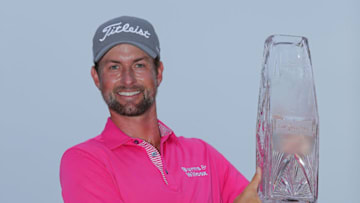 PONTE VEDRA BEACH, FLORIDA - MAY 13: Webb Simpson of the United States celebrates with the winner's trophy after the final round of THE PLAYERS Championship on the Stadium Course at TPC Sawgrass on May 13, 2018 in Ponte Vedra Beach, Florida. (Photo by Richard Heathcote/Getty Images)