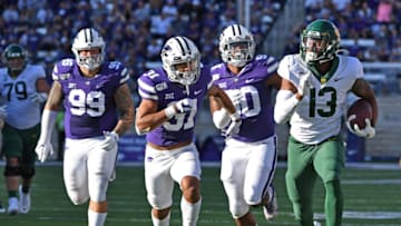 MANHATTAN, KS - OCTOBER 05: Wide receiver R.J. Sneed #13 of the Baylor Bears rushes up field after catching a pass against defensive back Jahron McPherson #31 of the Kansas State Wildcats during the second half at Bill Snyder Family Football Stadium on October 5, 2019 in Manhattan, Kansas. (Photo by Peter G. Aiken/Getty Images)