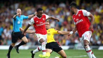 Arsenal's Joe Willock (left) and Watford's Craig Dawson battle for the ball during the Premier League match at Vicarage Road, Watford. (Photo by Nick Potts/PA Images via Getty Images)