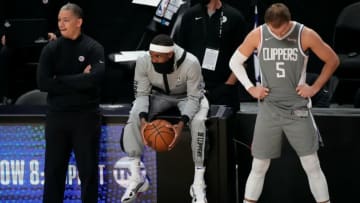 Clippers head coach Tyronn Lue and Rajon Rondo and guard Luke Kennard (5) react during the closing seconds of the Clippers loss to the Phoenix Suns in game four of the Western Conference Finals for the 2021 NBA Playoffs at Staples Center. Mandatory Credit: Robert Hanashiro-USA TODAY Sports