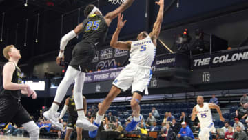 WASHINGTON, DC - MARCH 09: Justyn Mutts #25 of the Delaware Fightin Blue Hens tries block Eli Pemberton #5 of the Hofstra Pride shot during the CAA Men's Basketball Tournament - Semifinals college basketball game at the Entertainment & Sports Arena on March 9, 2020 in Washington, DC. (Photo by Mitchell Layton/Getty Images)