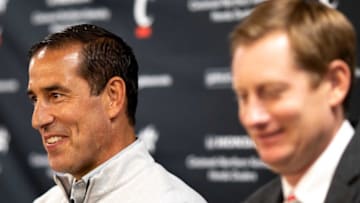 John Cunningham and Luke Fickell speak during a press conference. The Enquirer.