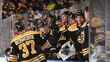 BUFFALO, NY - DECEMBER 27: Patrice Bergeron #37 of the Boston Bruins celebrates with teammates after scoring his second goal of the game against the Buffalo Sabres during an NHL game on December 27, 2019 at KeyBank Center in Buffalo, New York. (Photo by Joe Hrycych/NHLI via Getty Images)