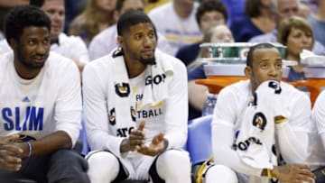 Nov 4, 2015; Indianapolis, IN, USA; From left to right Indiana Pacers forward Solomon HIll, Paul George, and guard Monta Ellis sit on the bench during a game against the Boston Celtics at Bankers Life Fieldhouse. Indiana defeats Boston 100-98. Mandatory Credit: Brian Spurlock-USA TODAY Sports