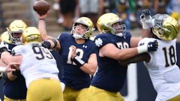 May 1, 2021; Notre Dame, Indiana, USA; Notre Dame Fighting Irish quarterback Tyler Buchner (12) throws in the third quarter of the Blue-Gold Game at Notre Dame Stadium. Mandatory Credit: Matt Cashore-USA TODAY Sports