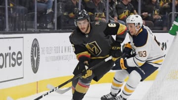 LAS VEGAS, NEVADA - OCTOBER 16: Colin Miller #6 of the Vegas Golden Knights skates with the puck under pressure from Jeff Skinner #53 of the Buffalo Sabres in the first period of their game at T-Mobile Arena on October 16, 2018 in Las Vegas, Nevada. The Golden Knights defeated the Sabres 4-1. (Photo by Ethan Miller/Getty Images)