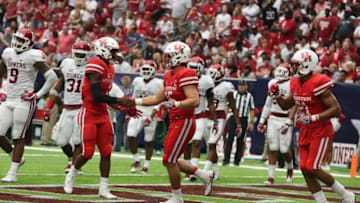 Sep 3, 2016; Houston, TX, USA; Houston Cougars quarterback Greg Ward Jr. (1) congratulates Houston Cougars wide receiver Linell Bonner (15) on his touchdown against the Oklahoma Sooners at NRG Stadium. Houston Cougars won 33 to 23. Mandatory Credit: Thomas B. Shea-USA TODAY Sports