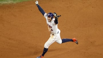 HOUSTON, TX - OCTOBER 19: George Springer #4 of the Houston Astros celebrates as he runs the bases after a home run by Jose Altuve #27 in the ninth inning against the Houston Astros during Game Six of the League Championship Series at Minute Maid Park on October 19, 2019 in Houston, Texas. (Photo by Tim Warner/Getty Images)