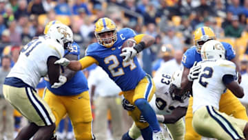 Oct 8, 2016; Pittsburgh, PA, USA; Pittsburgh Panthers running back James Conner (24) rushes the ball against the Georgia Tech Yellow Jackets during the third quarter at Heinz Field. Pittsburgh won 37-34. Mandatory Credit: Charles LeClaire-USA TODAY Sports
