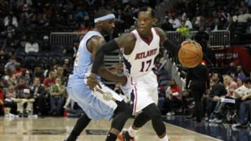 Dec 7, 2014; Atlanta, GA, USA; Atlanta Hawks guard Dennis Schroder (17) drives past Denver Nuggets guard Ty Lawson (3) in the third quarter at Philips Arena. Mandatory Credit: Brett Davis-USA TODAY Sports