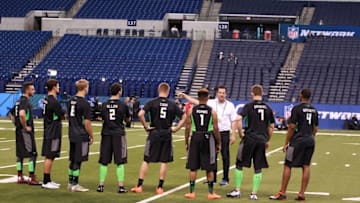 Feb 27, 2016; Indianapolis, IN, USA; Quarterbacks get instructions on workout drills during the 2016 NFL Scouting Combine at Lucas Oil Stadium. Mandatory Credit: Brian Spurlock-USA TODAY Sports