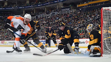 PITTSBURGH, PA - MARCH 17: Matt Murray #30 of the Pittsburgh Penguins defends the net in front of Brian Dumoulin #8 and Sean Couturier #14 of the Philadelphia Flyers at PPG Paints Arena on March 17, 2019 in Pittsburgh, Pennsylvania. (Photo by Joe Sargent/NHLI via Getty Images)