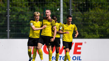 Bradley Fink celebrates his goal for the Borussia Dortmund U-19s. (Photo by Lukas Schulze/Getty Images)