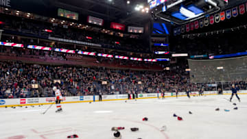 COLUMBUS, OH - DECEMBER 04: Columbus Blue Jackets fans throw hats on the ice after Columbus Blue Jackets right wing Cam Atkinson (not pictured) scored a hat trick in a game between the Columbus Blue Jackets and the Calgary Flames on December 04, 2018 at Nationwide Arena in Columbus, OH. (Photo by Adam Lacy/Icon Sportswire via Getty Images)