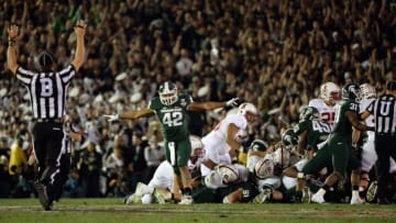 PASADENA, CA - JANUARY 01: Defensive end Denzel Drone #42 of the Michigan State Spartans celebrates after the Spartans stop the Stanford Cardinal on fourth down in the fourth quarter during the 100th Rose Bowl Game presented by Vizio at the Rose Bowl on January 1, 2014 in Pasadena, California. (Photo by Harry How/Getty Images)
