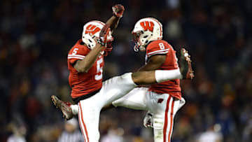 Dec 30, 2015; San Diego, CA, USA; Wisconsin Badgers cornerback Sojourn Shelton (8) is congratulated by cornerback Darius Hillary (5) after an interception against the USC Trojans during the fourth quarter in the 2015 Holiday Bowl at Qualcomm Stadium. Mandatory Credit: Jake Roth-USA TODAY Sports