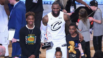 LOS ANGELES, CA - FEBRUARY 18: (L-R) LeBron James Jr., LeBron James