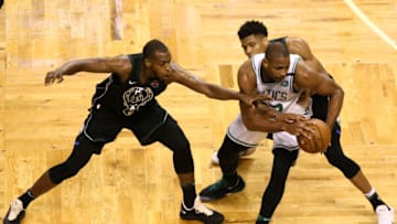 BOSTON, MA - APRIL 15: Khris Middleton #22 of the Milwaukee Bucks and Giannis Antetokounmpo #34 defend Al Horford #42 of the Boston Celtics during the fourth quarter of Game One of Round One of the 2018 NBA Playoffs during at TD Garden on April 15, 2018 in Boston, Massachusetts. (Photo by Maddie Meyer/Getty Images)