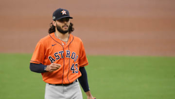 SAN DIEGO, CALIFORNIA - OCTOBER 17: Lance McCullers Jr. #43 of the Houston Astros reacts after his first pitch of the game hits Manuel Margot #13 of the Tampa Bay Rays during the first inning in Game Seven of the American League Championship Series at PETCO Park on October 17, 2020 in San Diego, California. (Photo by Harry How/Getty Images)