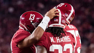 Alabama quarterback Tua Tagovailoa (13) and running back Najee Harris (22) celebrate Harris' touchdown against Tennessee at Bryant-Denny Stadium in Tuscaloosa, Ala., on Saturday October 19, 2019.Harris703