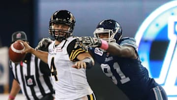 Zach Collaros #4 of the Hamilton Tiger-Cats is sacked by Matt Coates #81 of the Hamilton Tiger-Cats during their game at Rogers Centre on October 25, 2014 in Toronto, Canada. (Photo by Dave Sandford/Getty Images)
