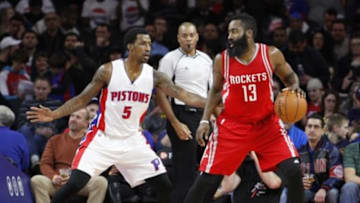 Nov 30, 2015; Auburn Hills, MI, USA; Houston Rockets guard James Harden (13) dribbles the ball as he is guarded by Detroit Pistons guard Kentavious Caldwell-Pope (5) during the first quarter at The Palace of Auburn Hills. Mandatory Credit: Raj Mehta-USA TODAY Sports