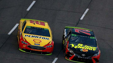 MARTINSVILLE, VA - OCTOBER 28: Joey Logano, driver of the #22 Shell Pennzoil Ford, and Martin Truex Jr., driver of the #78 5-hour ENERGY/Bass Pro Shops Toyota, race during the Monster Energy NASCAR Cup Series First Data 500 at Martinsville Speedway on October 28, 2018 in Martinsville, Virginia. (Photo by Sean Gardner/Getty Images)
