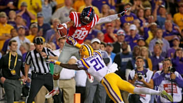 Oct 25, 2014; Baton Rouge, LA, USA; Mississippi Rebels wide receiver Cody Core (88) reaches for the end zone as he score a touchdown in front of LSU Tigers defensive back Rashard Robinson (21) in the first quarter at Tiger Stadium. Mandatory Credit: Crystal LoGiudice-USA TODAY Sports