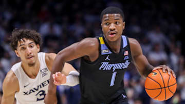 Jan 15, 2023; Cincinnati, Ohio, USA; Marquette Golden Eagles guard Kam Jones (1) dribbles against Xavier Musketeers guard Colby Jones (3) in the first half at Cintas Center. Mandatory Credit: Katie Stratman-USA TODAY Sports