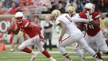 Oct 24, 2015; Louisville, KY, USA; Louisville Cardinals quarterback Lamar Jackson (8) runs the ball against Boston College Eagles defensive lineman Harold Landry (8) during the second quarter at Papa John