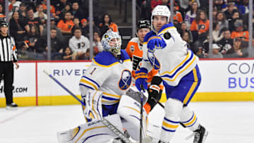 Apr 1, 2023; Philadelphia, Pennsylvania, USA; Buffalo Sabres defenseman Mattias Samuelsson (23) reaches for the puck in front of goaltender Ukko-Pekka Luukkonen (1) and Philadelphia Flyers left wing Brendan Lemieux (22) during the second period at Wells Fargo Center. Mandatory Credit: Eric Hartline-USA TODAY Sports