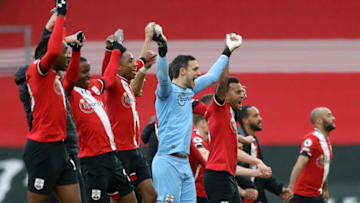 SOUTHAMPTON, ENGLAND - DECEMBER 13: Alex McCarthy of Southampton celebrates with his team as they celebrate with the fans in the stand after their teams victory during the Premier League match between Southampton and Sheffield United at St Mary's Stadium on December 13, 2020 in Southampton, England. A limited number of spectators (2000) are welcomed back to stadiums to watch elite football across England. This was following easing of restrictions on spectators in tiers one and two areas only. (Photo by Naomi Baker/Getty Images)
