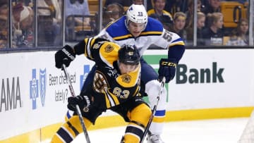 Dec 22, 2015; Boston, MA, USA; St. Louis Blues defenseman Colton Parayko (55) tries to stop Boston Bruins left wing Brad Marchand (63) during the first period at TD Garden. Mandatory Credit: Winslow Townson-USA TODAY Sports