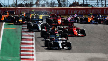 AUSTIN, TEXAS - NOVEMBER 03: Valtteri Bottas driving the (77) Mercedes AMG Petronas F1 Team Mercedes W10 leads Max Verstappen of the Netherlands driving the (33) Aston Martin Red Bull Racing RB15 and the rest of the field into turn two at the start during the F1 Grand Prix of USA at Circuit of The Americas on November 03, 2019 in Austin, Texas. (Photo by Dan Istitene/Getty Images)