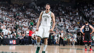 MILWAUKEE, WI - MAY 15: Brook Lopez #11 of the Milwaukee Bucks handles the ball against the Toronto Raptors during Game One of the Eastern Conference Finals of the 2019 NBA Playoffs on May 15, 2019 at the Fiserv Forum Center in Milwaukee, Wisconsin. NOTE TO USER: User expressly acknowledges and agrees that, by downloading and or using this Photograph, user is consenting to the terms and conditions of the Getty Images License Agreement. Mandatory Copyright Notice: Copyright 2019 NBAE (Photo by Nathaniel S. Butler/NBAE via Getty Images).