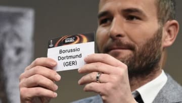 Former Swiss forward and this year's UEFA Europa League final ambassador Alexander Frei shows the name of Borussia Dortmund during the round of 16 draw of the UEFA Europa League football championship at the UEFA headquarters in Nyon on February 26, 2016. AFP PHOTO / ALAIN GROSCLAUDE / AFP / ALAIN GROSCLAUDE (Photo credit should read ALAIN GROSCLAUDE/AFP/Getty Images)