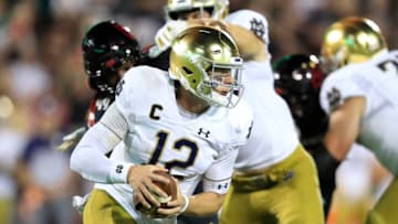 LOUISVILLE, KENTUCKY - SEPTEMBER 02: Ian Book #12 of the Notre Dame Fighting Irish runs with the ball against the Louisville Cardinals on September 02, 2019 in Louisville, Kentucky. (Photo by Andy Lyons/Getty Images)