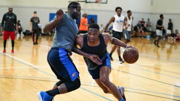Russell Westbrook dribbles the ball against defender Deonte Burton OKC Thunder (Photo by Cassy Athena/Getty Images)