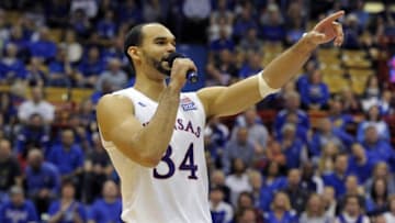 Mar 5, 2016; Lawrence, KS, USA; Kansas Jayhawks forward Perry Ellis (34) talks to the crowd after the senior game against the Iowa State Cyclones at Allen Fieldhouse. Kansas won the game 85-78. Mandatory Credit: John Rieger-USA TODAY Sports