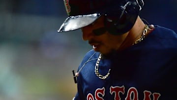ST PETERSBURG, FLORIDA - SEPTEMBER 20: Mookie Betts #50 of the Boston Red Sox runs back to the dugout after grounding out against the Tampa Bay Rays at Tropicana Field on September 20, 2019 in St Petersburg, Florida. (Photo by Julio Aguilar/Getty Images)