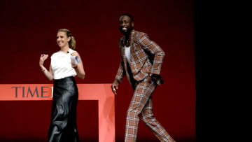 Poppy Harlow and Miami Heat legend, Dwyane Wade, appear onstage at the TIME100 Summit 2022 at Jazz at Lincoln Center (Photo by Jemal Countess/Getty Images for TIME)