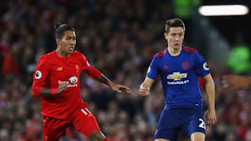 LIVERPOOL, ENGLAND - OCTOBER 17: Ander Herrera of Manchester United is closed down by Roberto Firmino of Liverpool during the Premier League match between Liverpool and Manchester United at Anfield on October 17, 2016 in Liverpool, England. (Photo by Clive Brunskill/Getty Images)