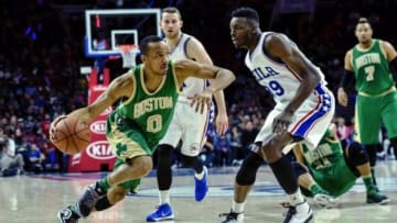 Mar 20, 2016; Philadelphia, PA, USA; Boston Celtics guard Avery Bradley (0) drives toward the net as Philadelphia 76ers forward Jerami Grant (39) defends during the third quarter of the game at the Wells Fargo Center. The Celtics won the game 120-105. Mandatory Credit: John Geliebter-USA TODAY Sports