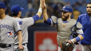 Sep 4, 2016; St. Petersburg, FL, USA; Toronto Blue Jays catcher Russell Martin (55) celebrates with teammates after defeating the Tampa Bay Rays 5-3 at Tropicana Field. Mandatory Credit: Kim Klement-USA TODAY Sports