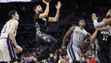 Dec 31, 2015; Auburn Hills, MI, USA; Minnesota Timberwolves guard Ricky Rubio (9) takes a shot over Detroit Pistons guard Reggie Jackson (1) during the second quarter at The Palace of Auburn Hills. Mandatory Credit: Raj Mehta-USA TODAY Sports