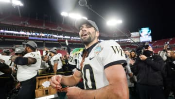 Dec 23, 2022; Tampa, Florida, USA; Wake Forest Demon Deacons quarterback Sam Hartman (10) celebrates after beating the Missouri Tigers in the 2022 Gasparilla Bowl at Raymond James Stadium. Mandatory Credit: Nathan Ray Seebeck-USA TODAY Sports