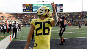 CORVALLIS, OREGON - NOVEMBER 23: Running back Travis Dye #26 of the Oregon Ducks celebrates after scoring a touchdown during the second half of the game against the Oregon State Beavers at Reser Stadium on November 23, 2018 in Corvallis, Oregon. (Photo by Steve Dykes/Getty Images)